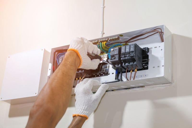 Electrician Installing Circuit Breaker